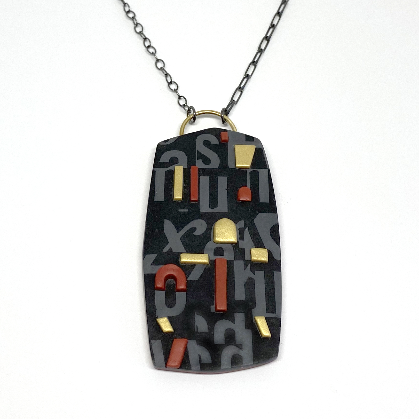Jand Pellicciotto polymer clay pendant with brass and sterling silver.